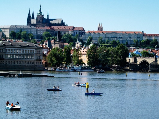 St. Charles Bridge spans across the river connecting two quarters of the town .